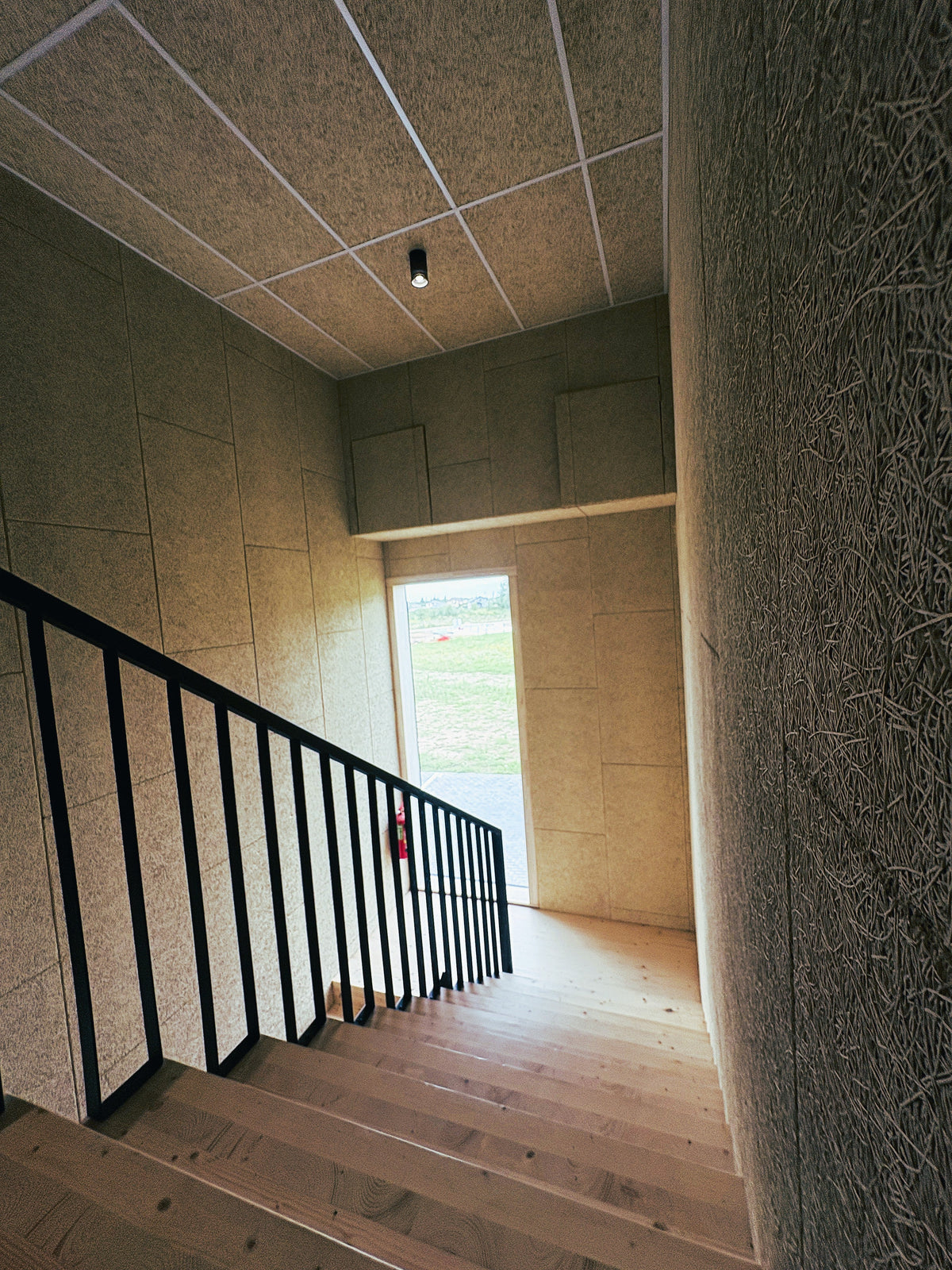Sonablock wood wool cement board in a hallway, reference project