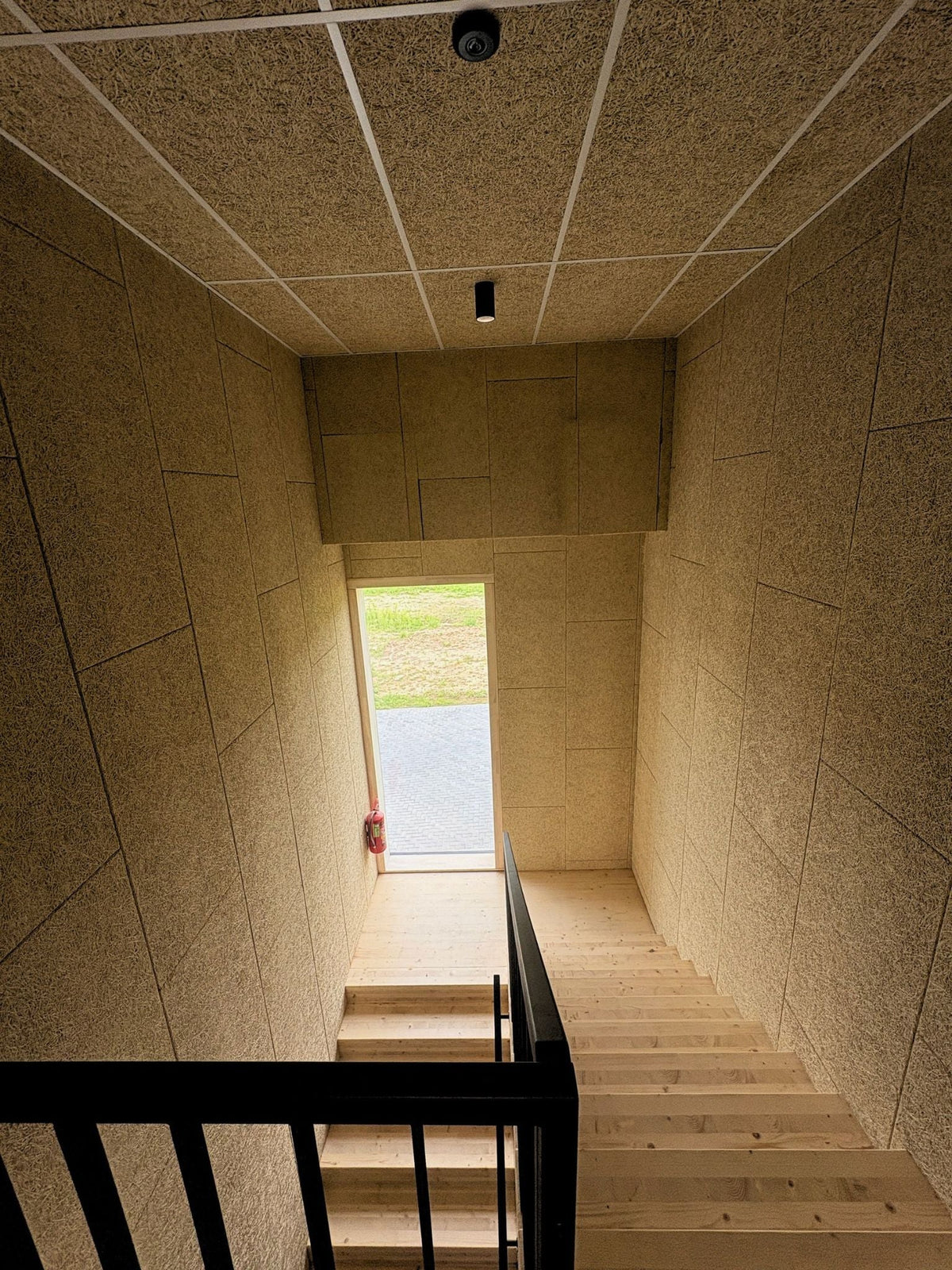 Sonablock panels on hallway ceiling and walls, reference project