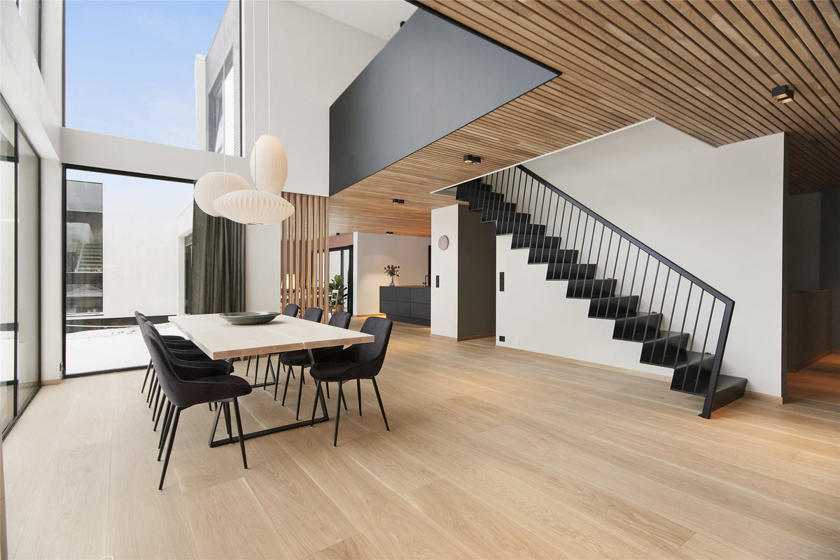Open plan home with thermo aspen slat ceiling and wall above a dining table