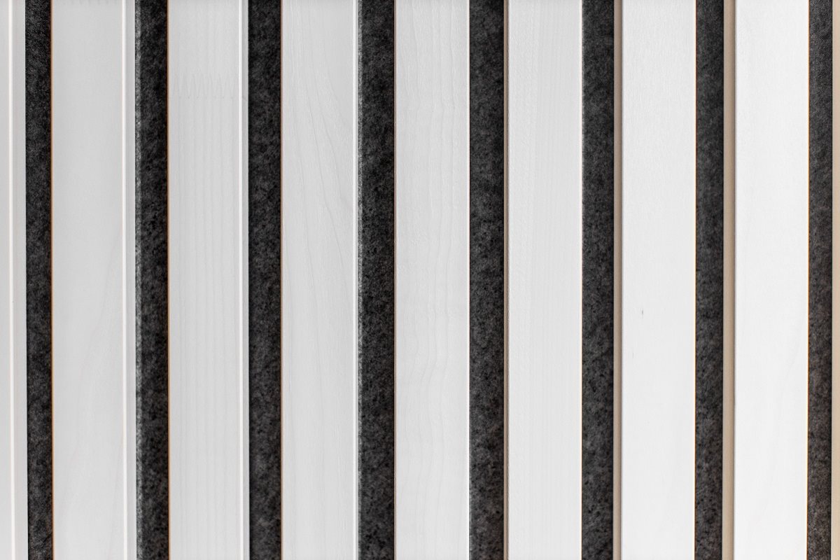Close-up of white aspen slats with black felt gaps