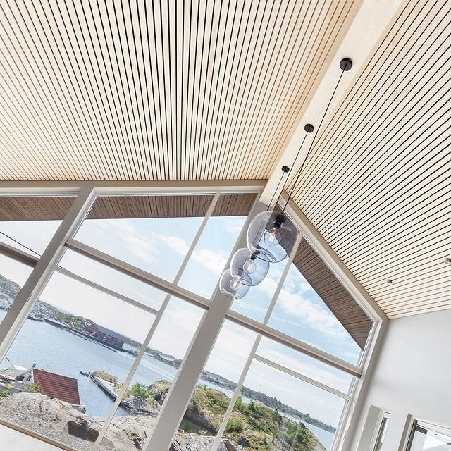 White slat acoustic ceiling in a house with a coastal view