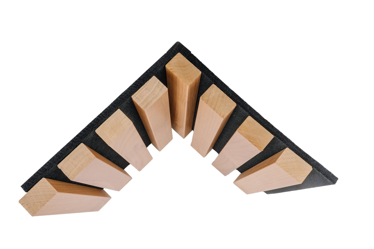 Thermo aspen slats on black felt arranged around a corner, seen from the end on a white background