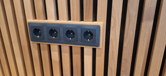 Thermo plate with four black sockets on a thermo slat wall