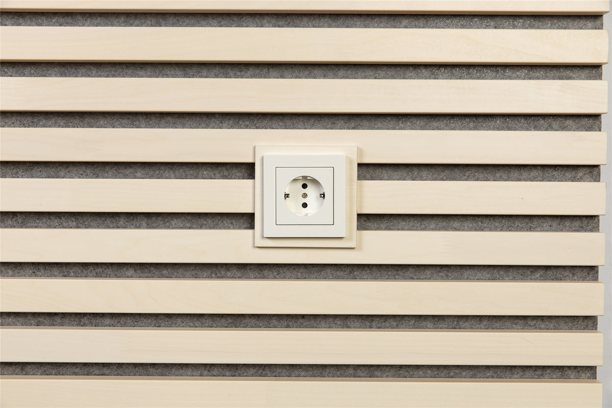 White plate around a wall socket on white aspen slats with grey felt