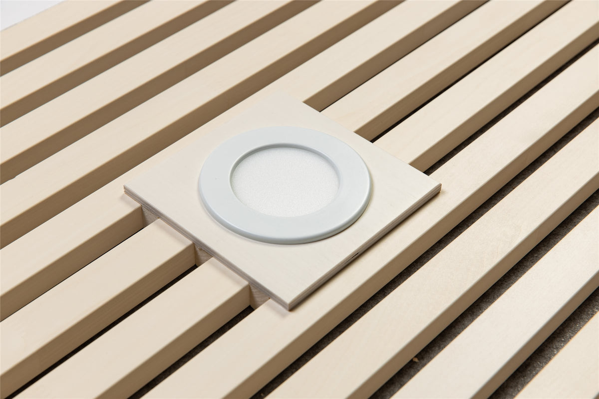 White universal plate with a round ceiling light on white aspen slats